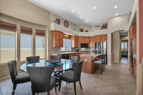 a view of a dining room with furniture window and outside view