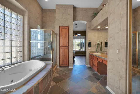 a bathroom with a bathtub and a sink