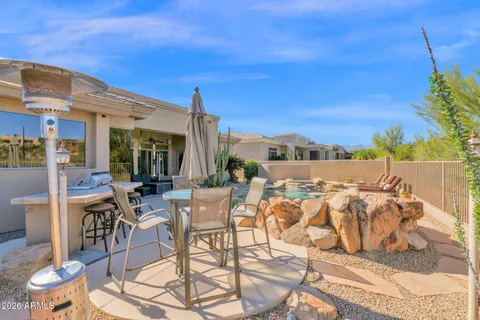 a view of swimming pool with outdoor seating
