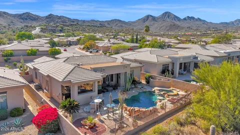 a view of a town with mountains in the background
