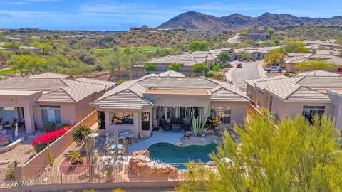 a view of a city with mountains in the background