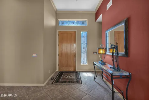 a room that has a bed and a dresser in it