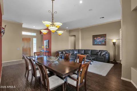 a view of a dining room with furniture and wooden floor