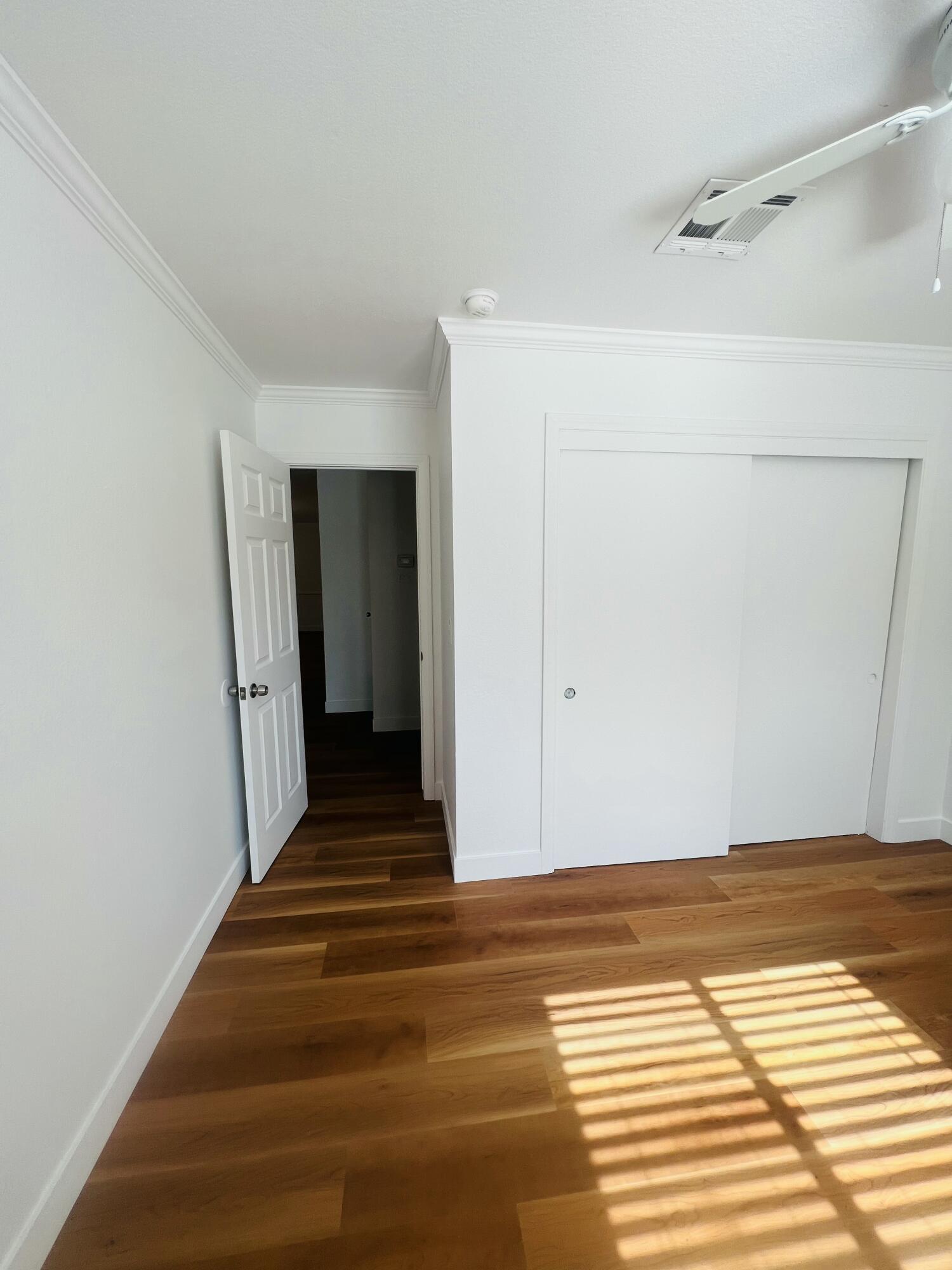 32900 Monte Vista Road Cathedral City, CA 92234 - Photo 12 of 18 a view of a room with wooden floor and white walls