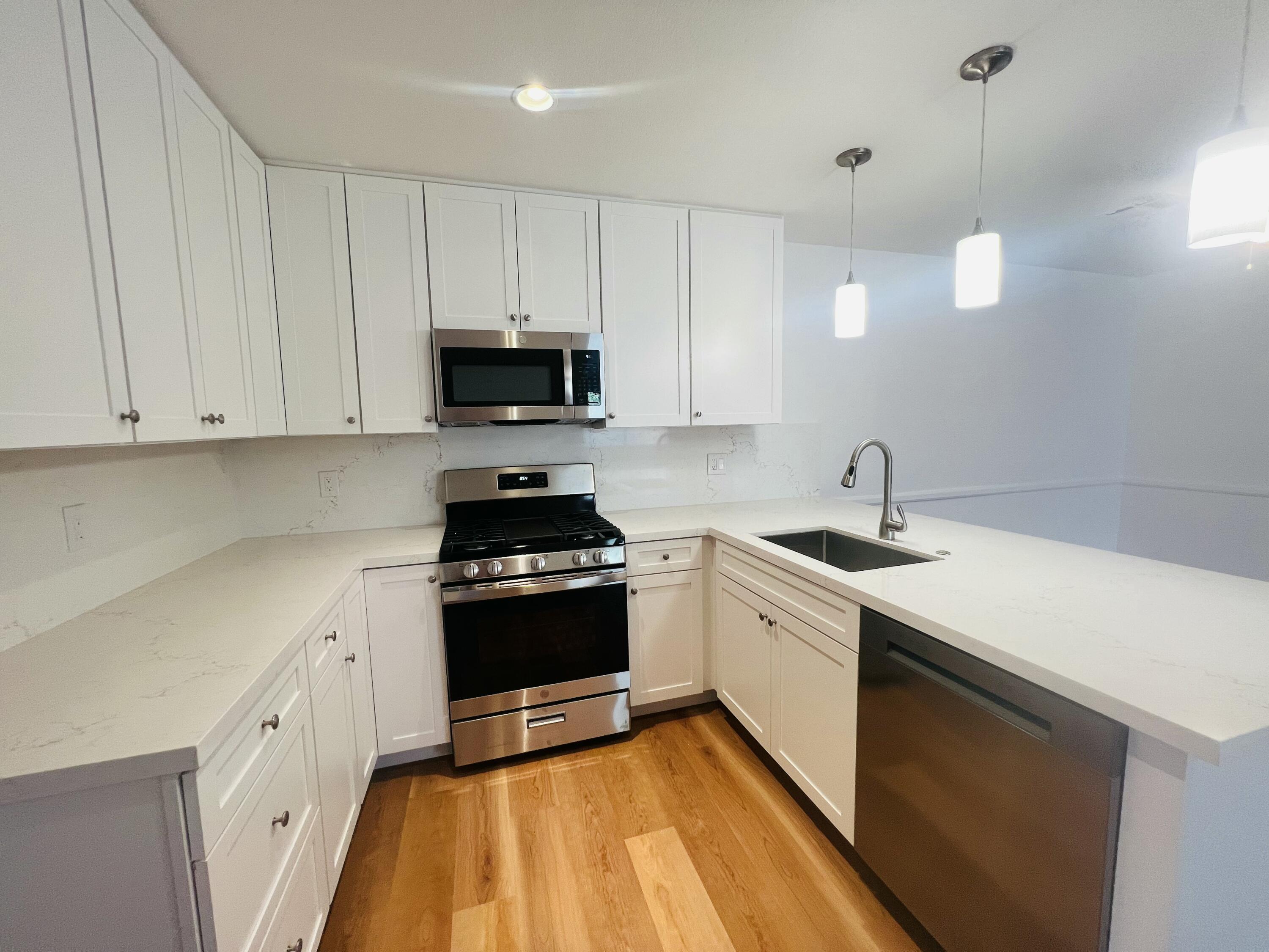 32900 Monte Vista Road Cathedral City, CA 92234 - Photo 6 of 18 a kitchen with a sink stove and cabinets