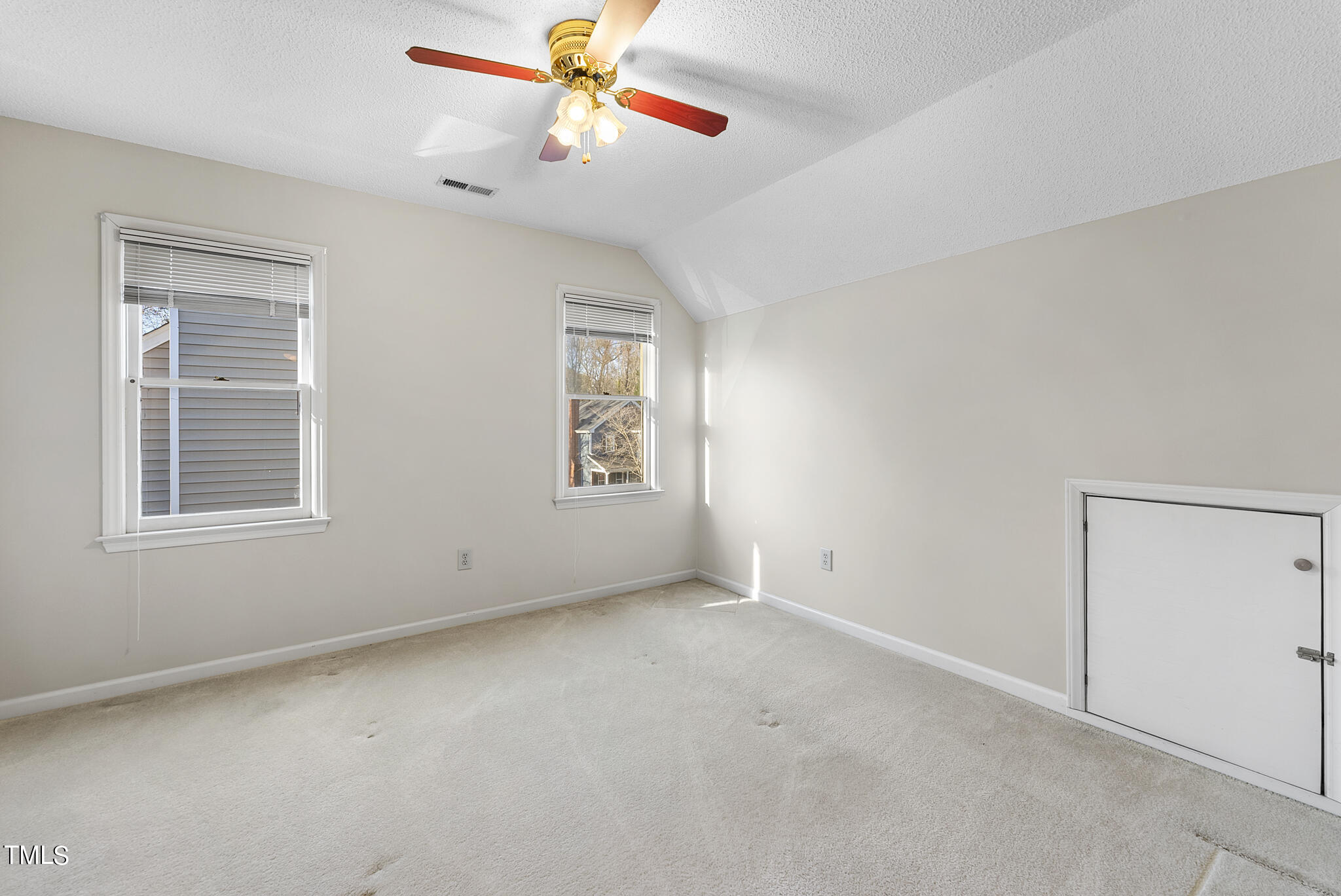 2912 Bannf Court Raleigh, NC 27604 - Photo 18 of 30 an empty room with windows and fan
