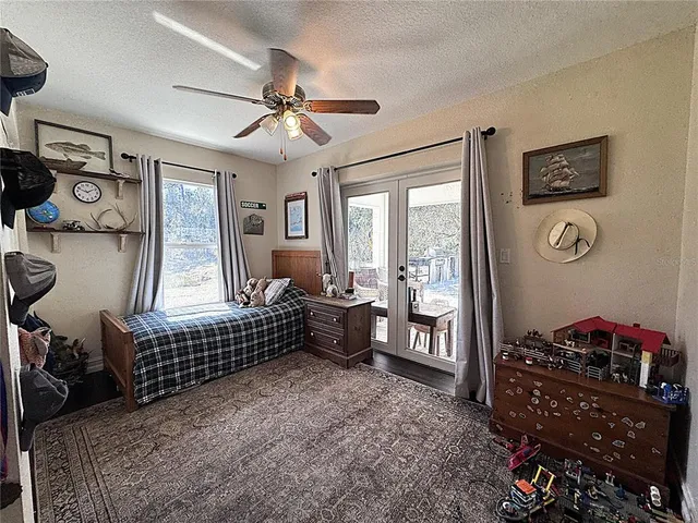 a bedroom with furniture and a window