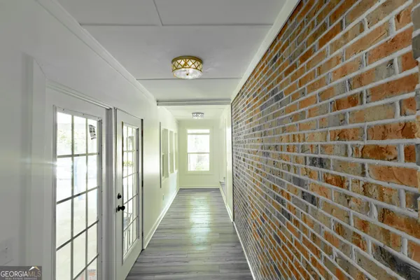 a view of a hallway with windows