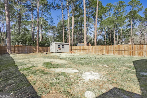 a bathroom with a sink and a yard