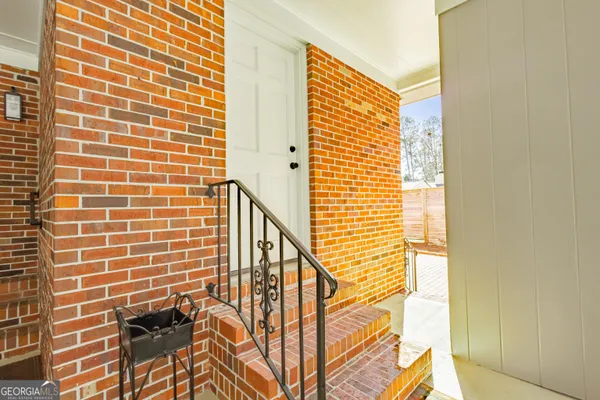 a view of a house with a small yard