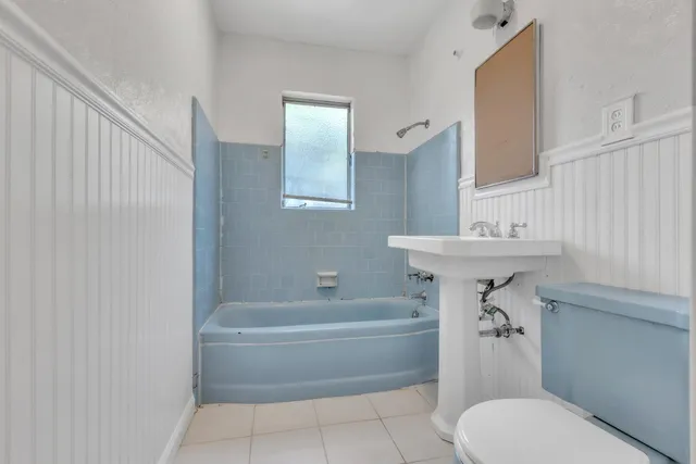 a bathroom with a sink toilet and bathtub