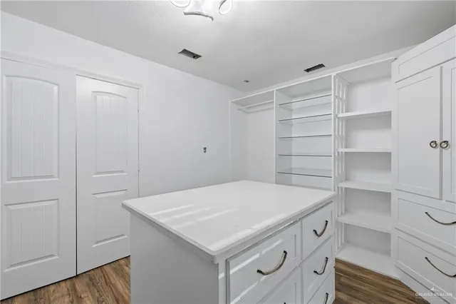 a utility room with cabinets