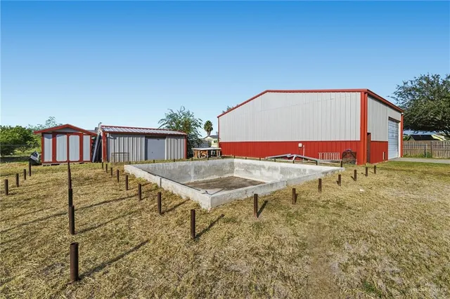 a view of a house with a backyard