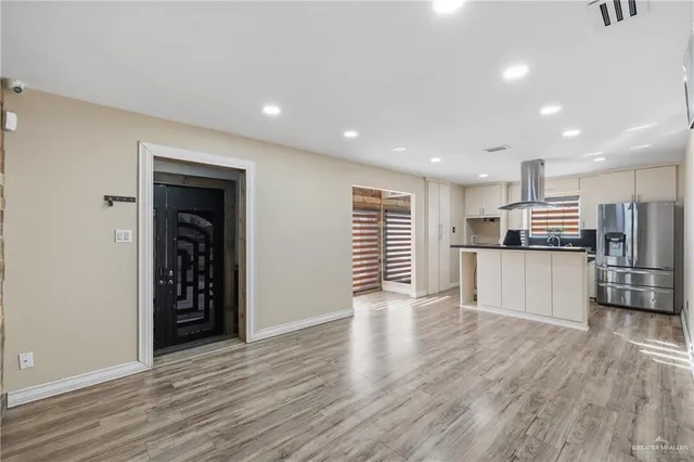 a view of kitchen with stainless steel appliances refrigerator oven and stove