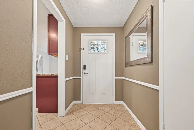 a view of an entryway with wooden floor