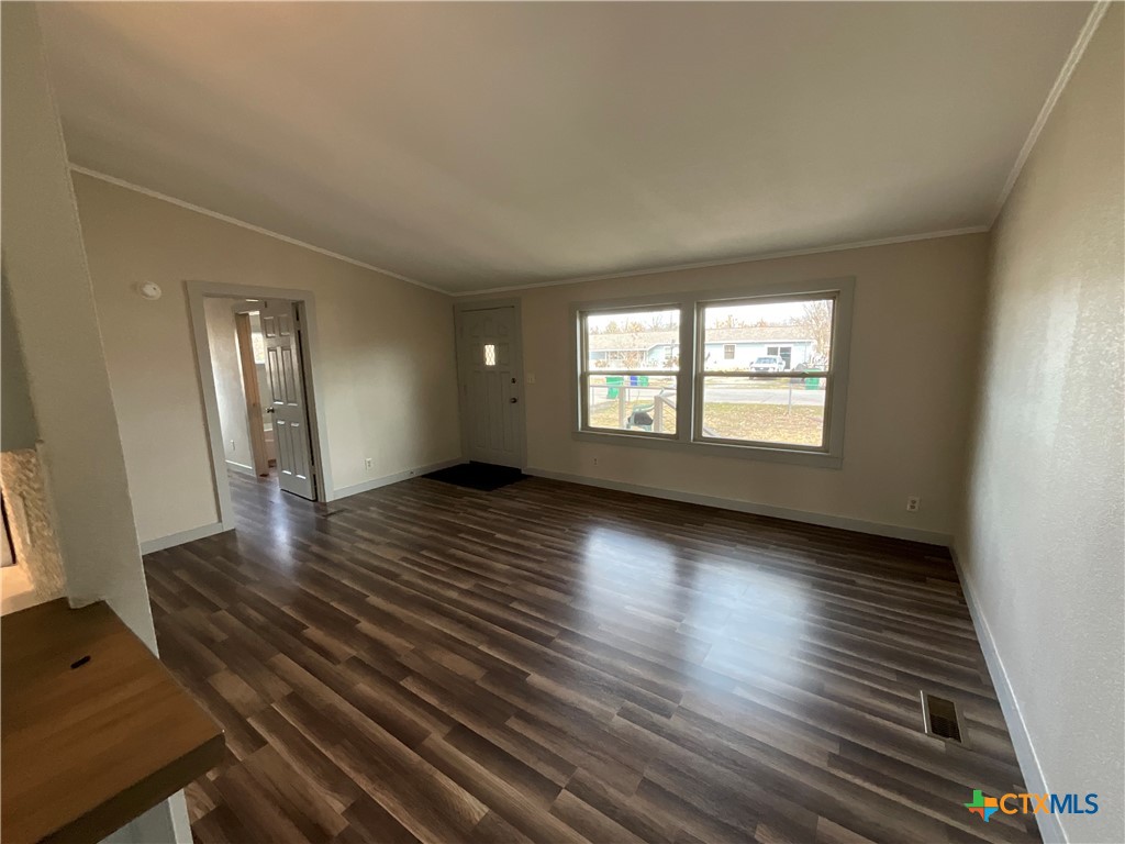 2301 Sumac Lane Cedar Park, TX 78613 - Photo 19 of 26 an empty room with wooden floor and windows