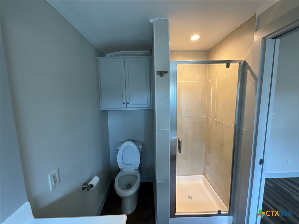 2301 Sumac Lane Cedar Park, TX 78613 - Photo 21 of 26 a bathroom with a shower and toilet
