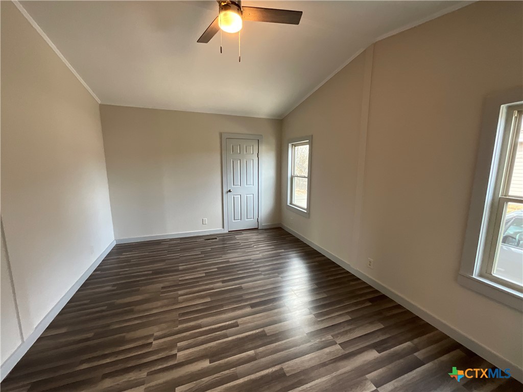 2301 Sumac Lane Cedar Park, TX 78613 - Photo 22 of 26 a view of an empty room with wooden floor and a window