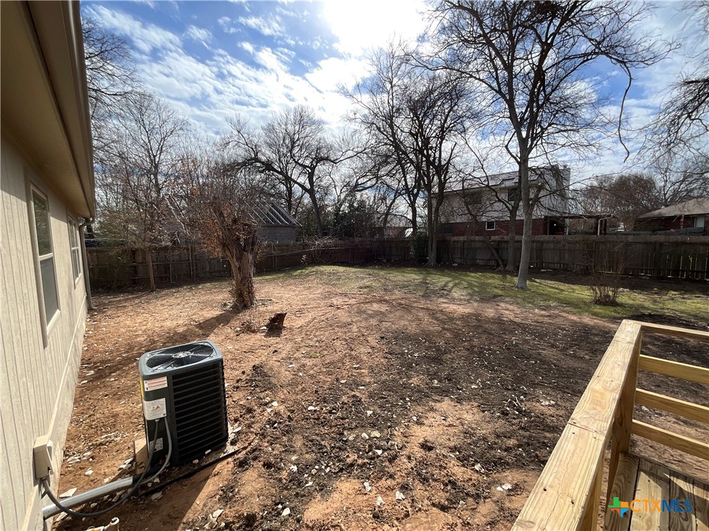 2301 Sumac Lane Cedar Park, TX 78613 - Photo 9 of 26 a backyard of a house with lots of green space