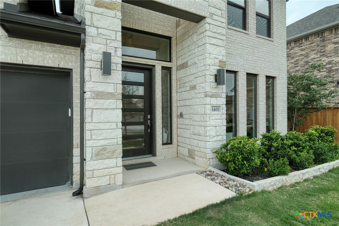 1401 Mulberry Oak Lane Georgetown, TX 78628 - Photo 1 of 29 a view of brick house with a large windows