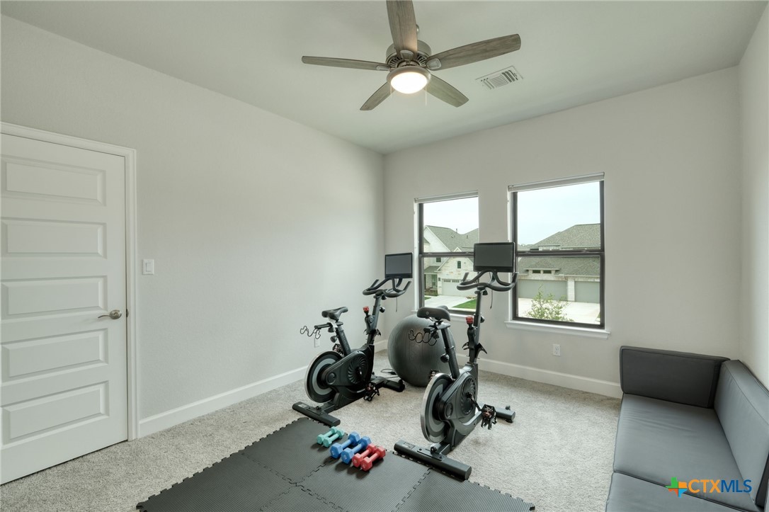 1401 Mulberry Oak Lane Georgetown, TX 78628 - Photo 22 of 29 a view of a room with gym equipment