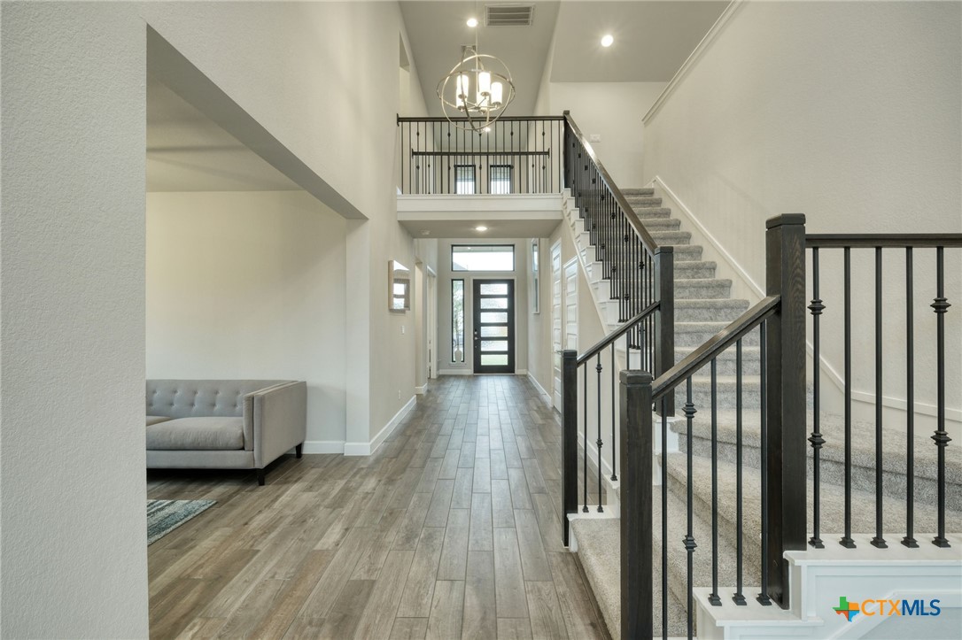 1401 Mulberry Oak Lane Georgetown, TX 78628 - Photo 3 of 29 a view of entryway and hall with wooden floor