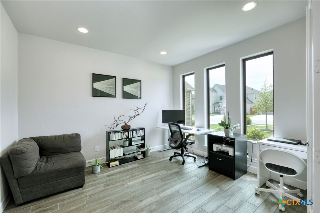 1401 Mulberry Oak Lane Georgetown, TX 78628 - Photo 6 of 30 Home office positioned at the front of the home, featuring recessed lighting and baseboards