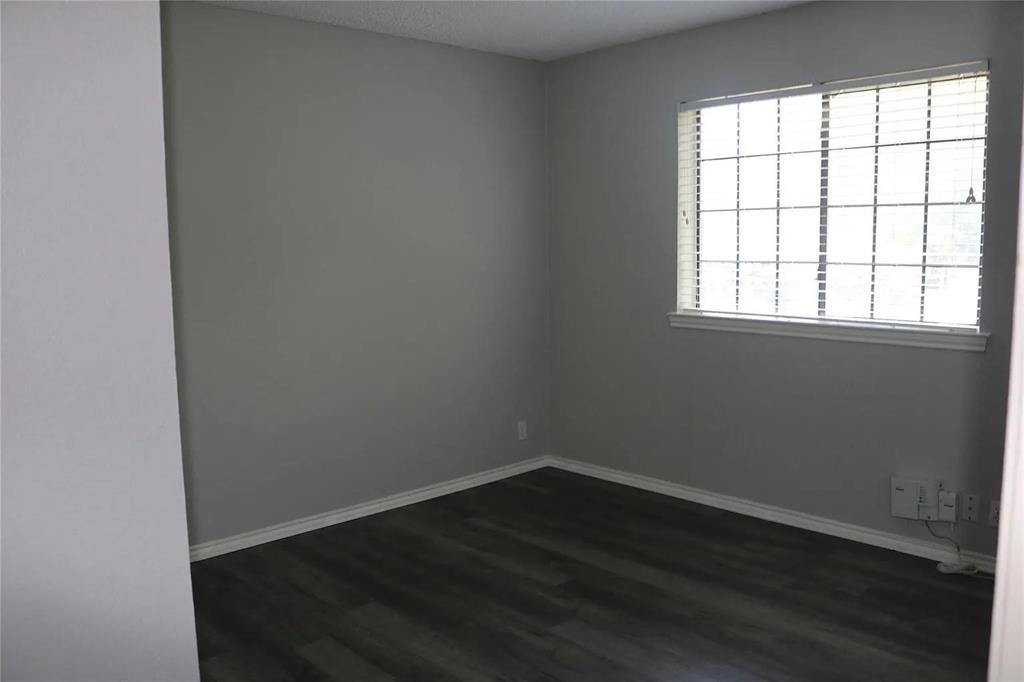 627 Cherry Lane Southlake, TX 76092 - Photo 14 of 19 Spare room with dark wood finished floors and baseboards