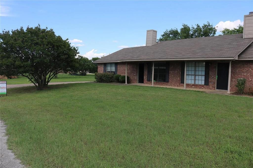 627 Cherry Lane Southlake, TX 76092 - Photo 3 of 19 View of front of property featuring a chimney, a front yard, and brick siding