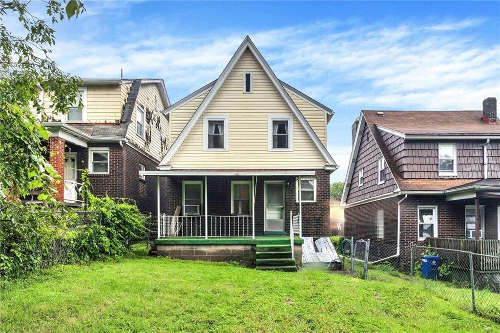 2606 Belmar Place Pittsburgh, PA 15218 - Photo 16 of 18 a front view of a house with a yard and porch