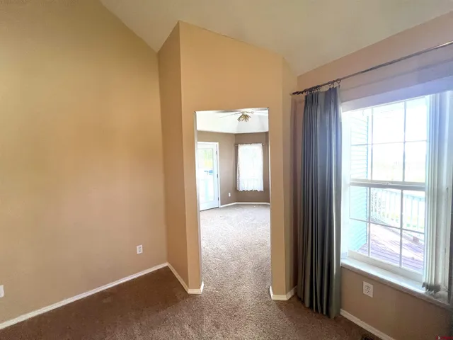 a view of a room that has a window