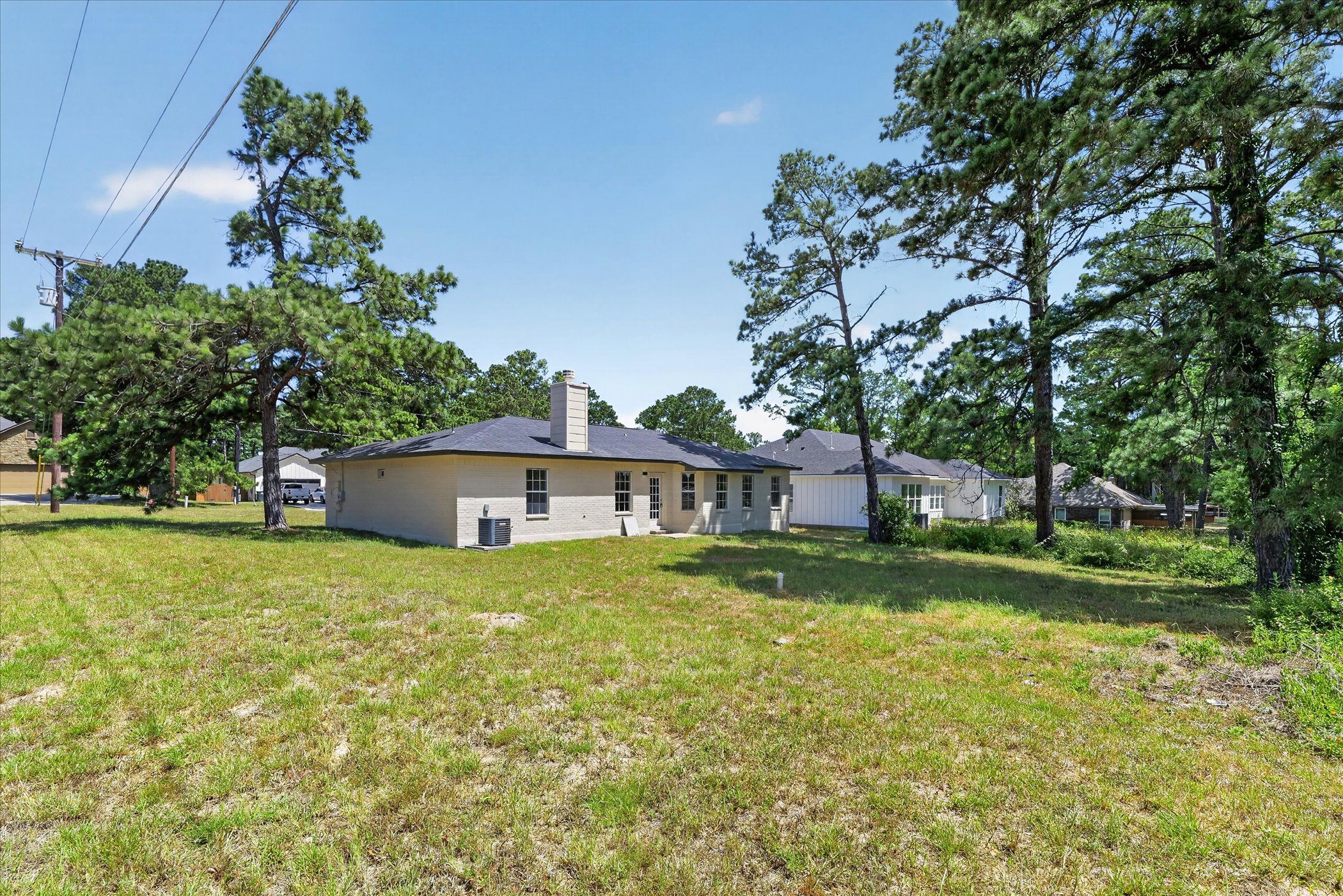 258 Pine View Loop Bastrop, TX 78602 - Photo 38 of 40 A generous backyard offers ample space for outdoor living and recreation.