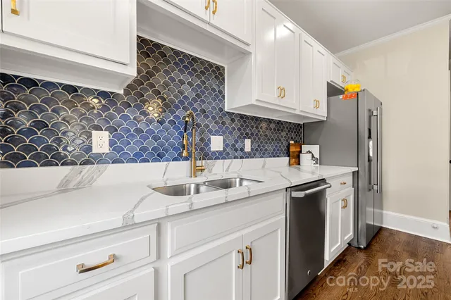 a kitchen with a sink and a refrigerator