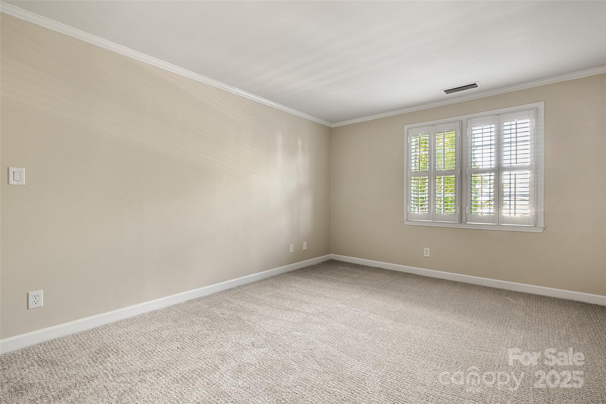 153 Perrin Place, Unit 153 Charlotte, NC 28207 - Photo 24 of 28 an empty room with a window