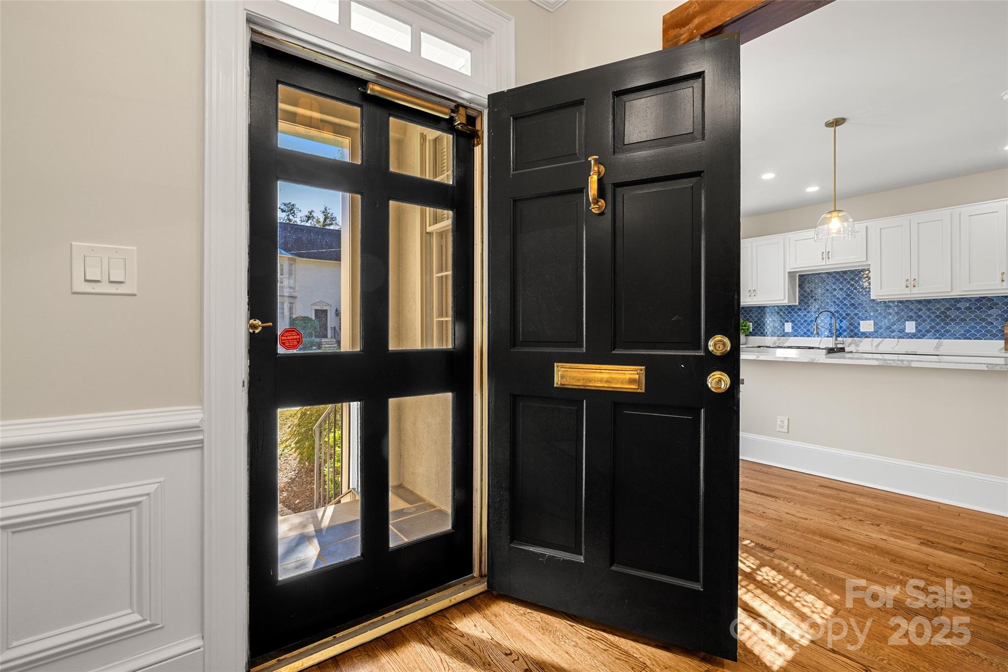 153 Perrin Place, Unit 153 Charlotte, NC 28207 - Photo 3 of 28 a view of a living room with a large window