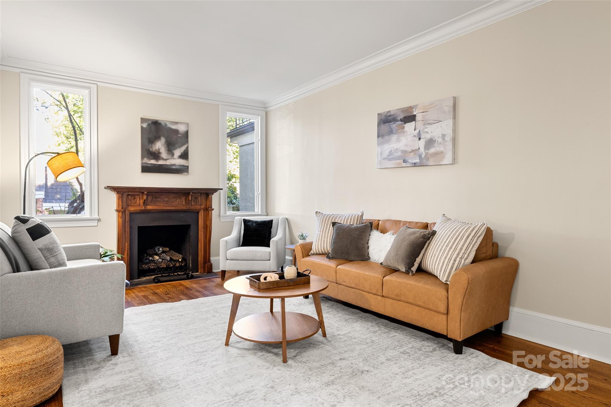 153 Perrin Place, Unit 153 Charlotte, NC 28207 - Photo 7 of 28 a living room with furniture and a fireplace