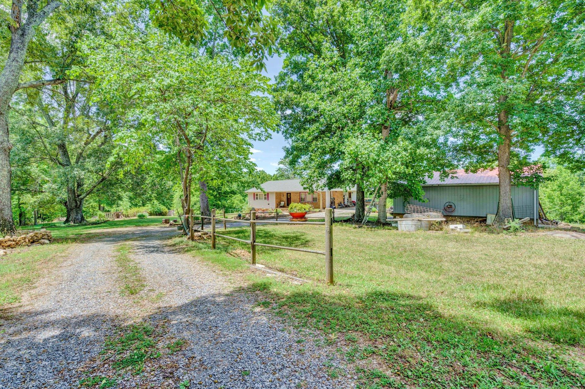 3370 Ayers Road Moneta, VA 24121 - Photo 22 of 35 a small garden covered with tall trees