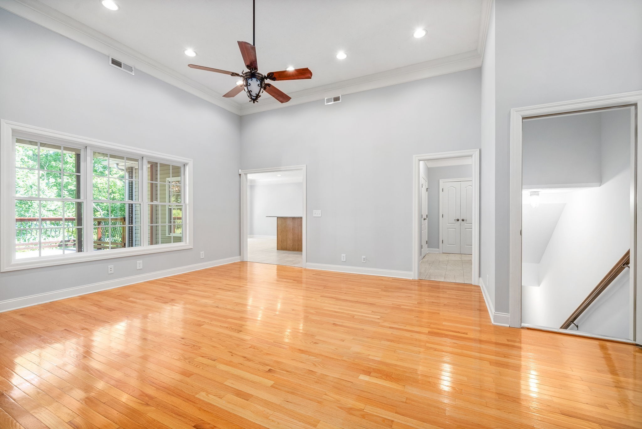 245 Cullom Way Clarksville, TN 37043 - Photo 12 of 74 a view of an empty room with wooden floor and a window