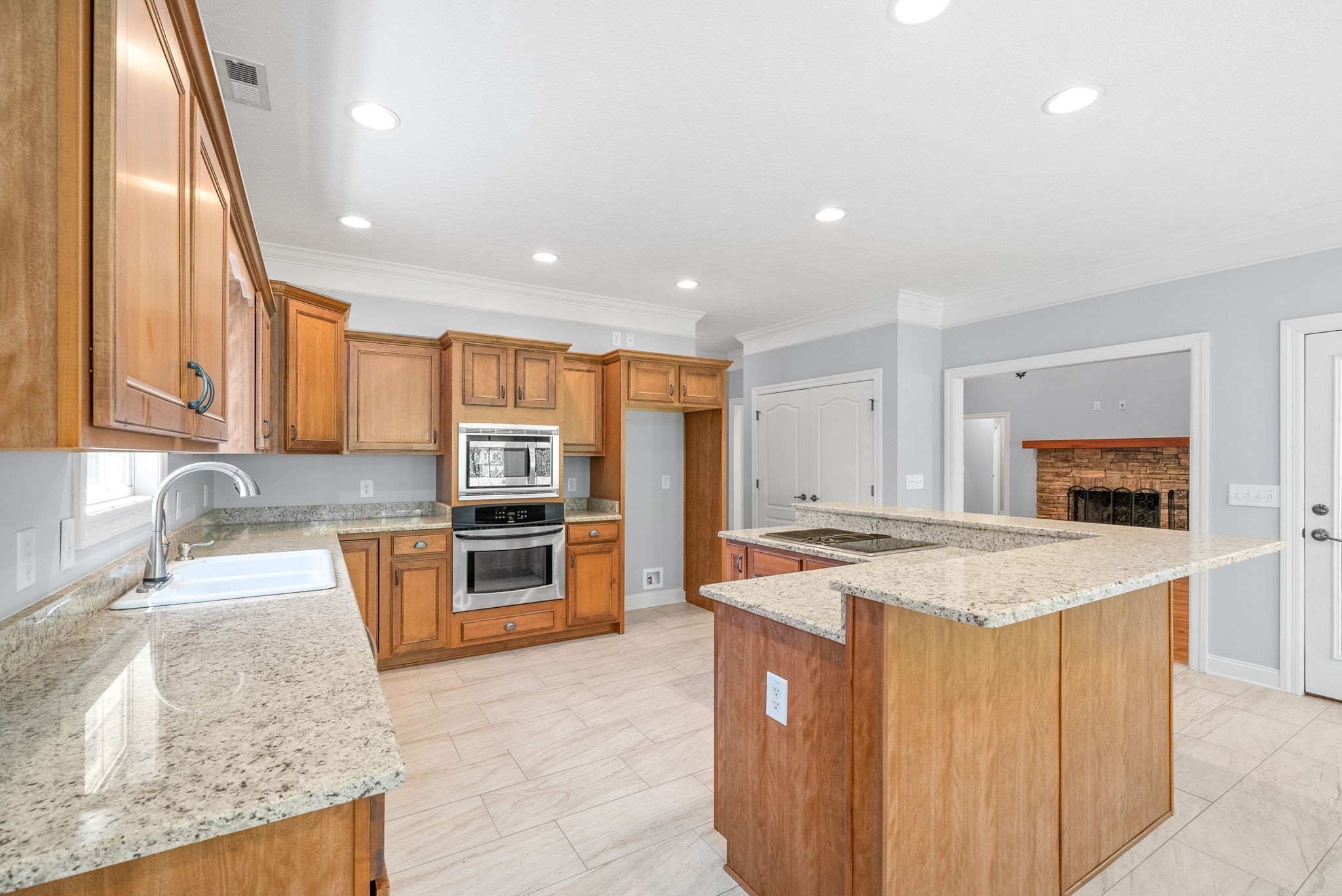 245 Cullom Way Clarksville, TN 37043 - Photo 17 of 74 a kitchen with stainless steel appliances granite countertop a sink stove and refrigerator
