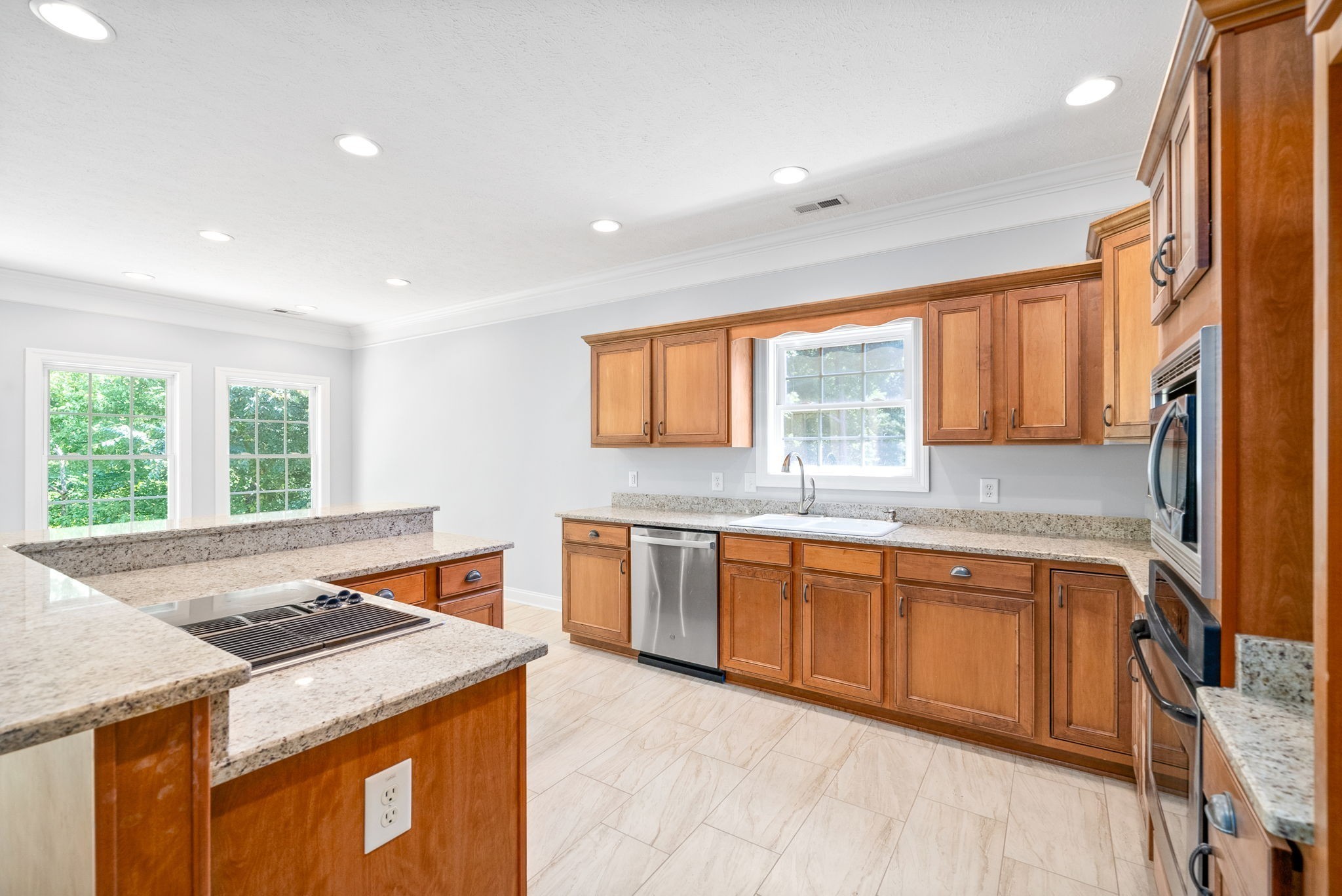 245 Cullom Way Clarksville, TN 37043 - Photo 22 of 74 a kitchen with stainless steel appliances granite countertop wooden cabinets and a sink