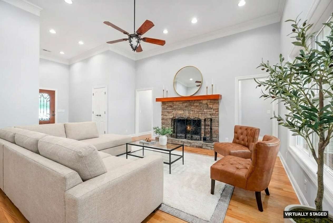 245 Cullom Way Clarksville, TN 37043 - Photo 9 of 74 a living room with furniture a fireplace and a potted plant