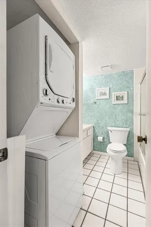 a bathroom with a glass shower door and mirror