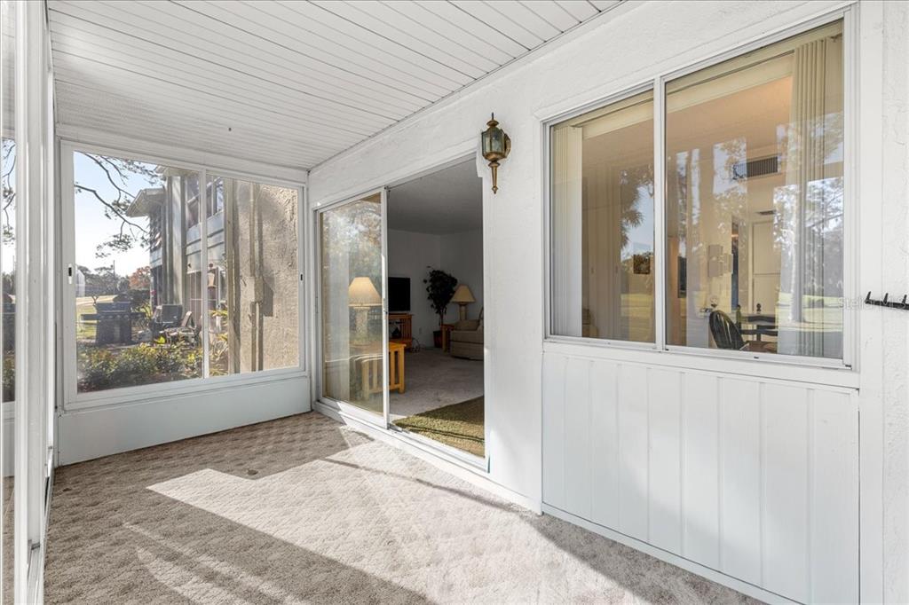 584 Fairways Circle, Unit A Ocala, FL 34472 - Photo 23 of 41 a view of a hallway with a glass door and glass door