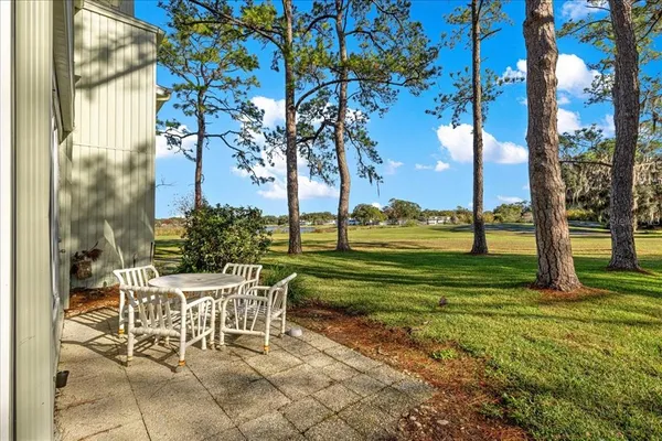 a view of a chairs and tables in the yard