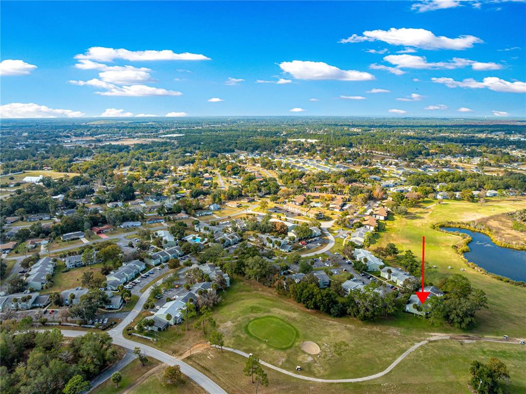 584 Fairways Circle, Unit A Ocala, FL 34472 - Photo 33 of 41 an aerial view of residential houses with outdoor space