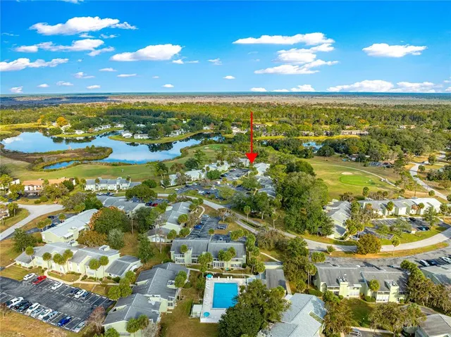 a view of an ocean and residential houses with outdoor space