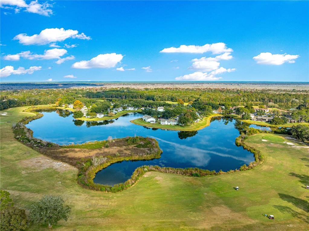 584 Fairways Circle, Unit A Ocala, FL 34472 - Photo 37 of 41 a view of an ocean and residential houses with outdoor space