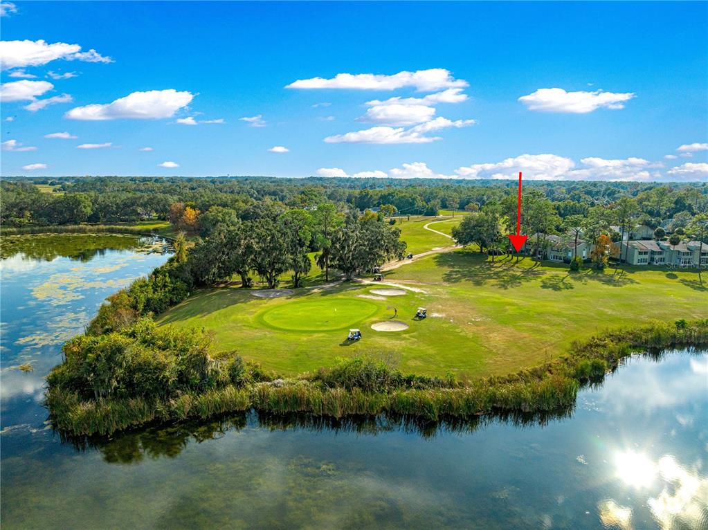 584 Fairways Circle, Unit A Ocala, FL 34472 - Photo 40 of 41 a view of a lake with a big yard