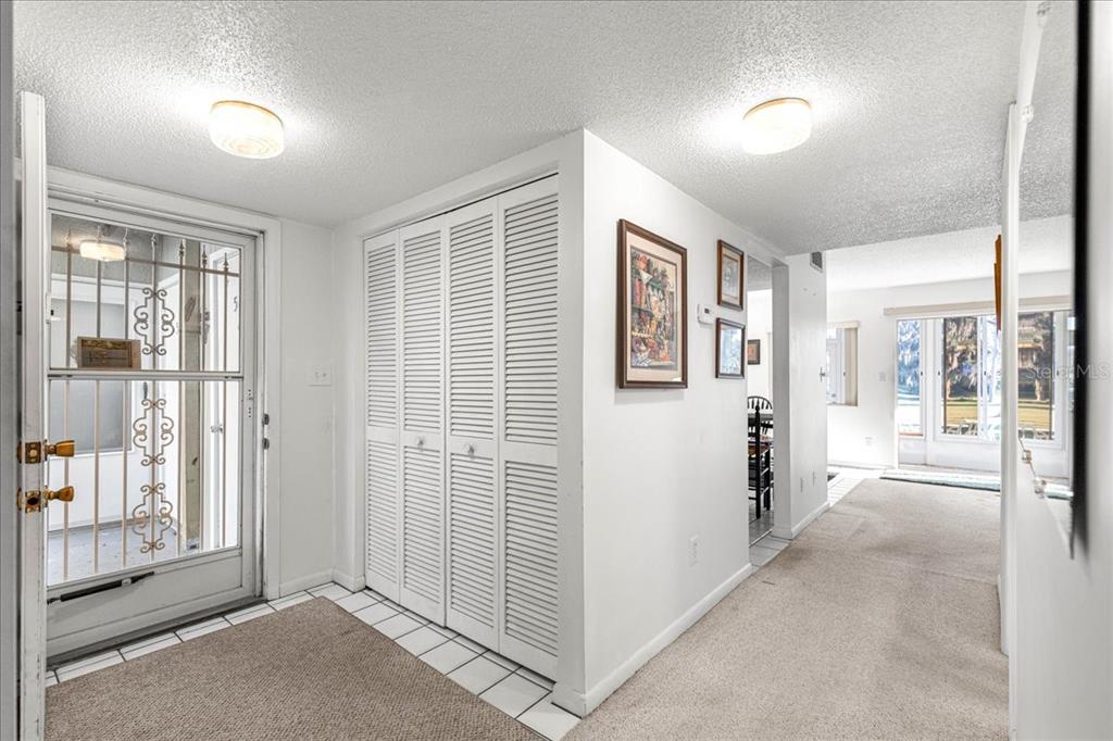 584 Fairways Circle, Unit A Ocala, FL 34472 - Photo 4 of 41 a view of a big room with windows and entryway of the house