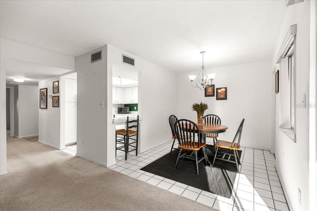 584 Fairways Circle, Unit A Ocala, FL 34472 - Photo 7 of 41 a view of a dining room with furniture and window